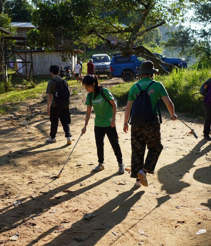 Cleaning up the clinic site using trash pickers
