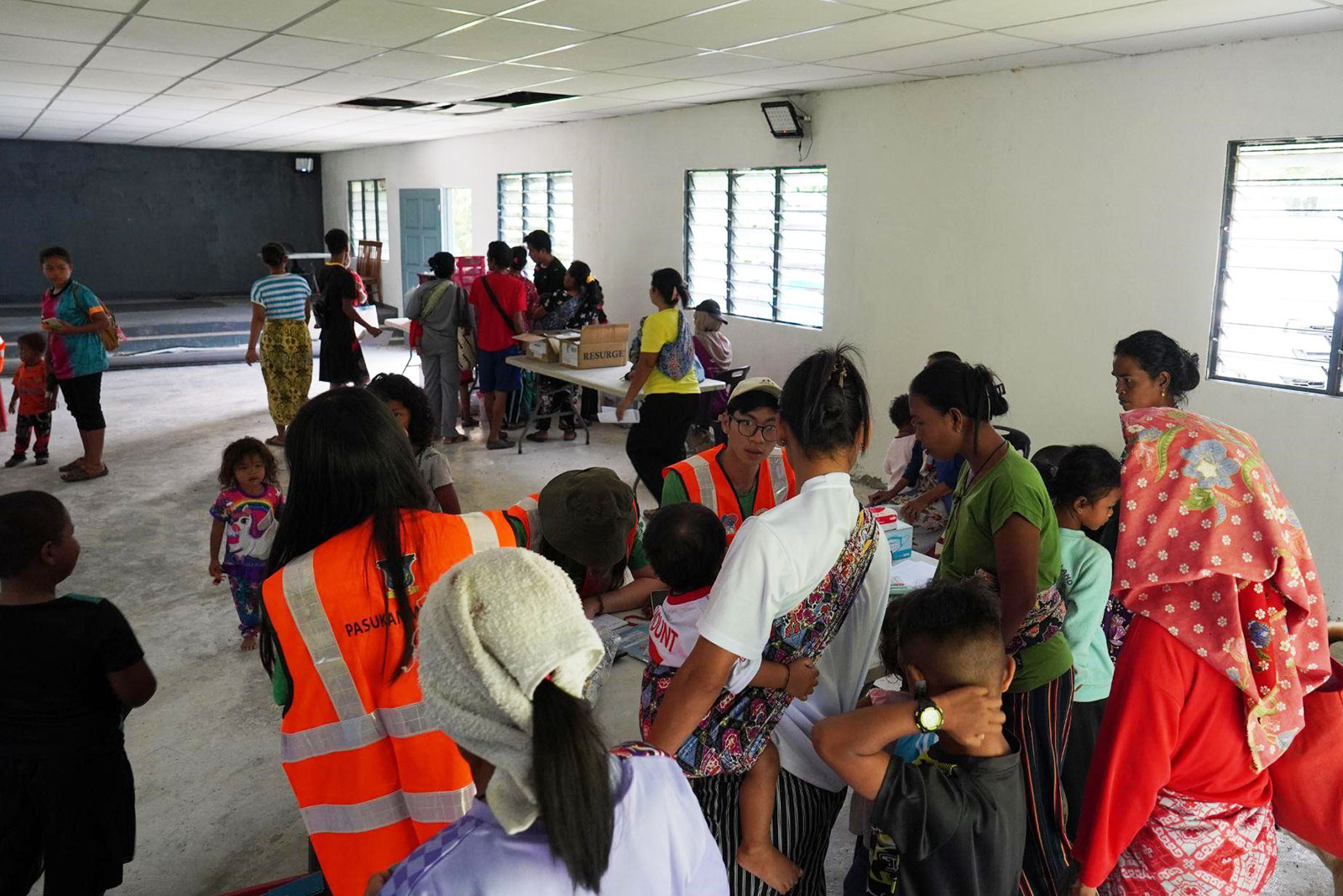 Villagers register at the clinic for treatment